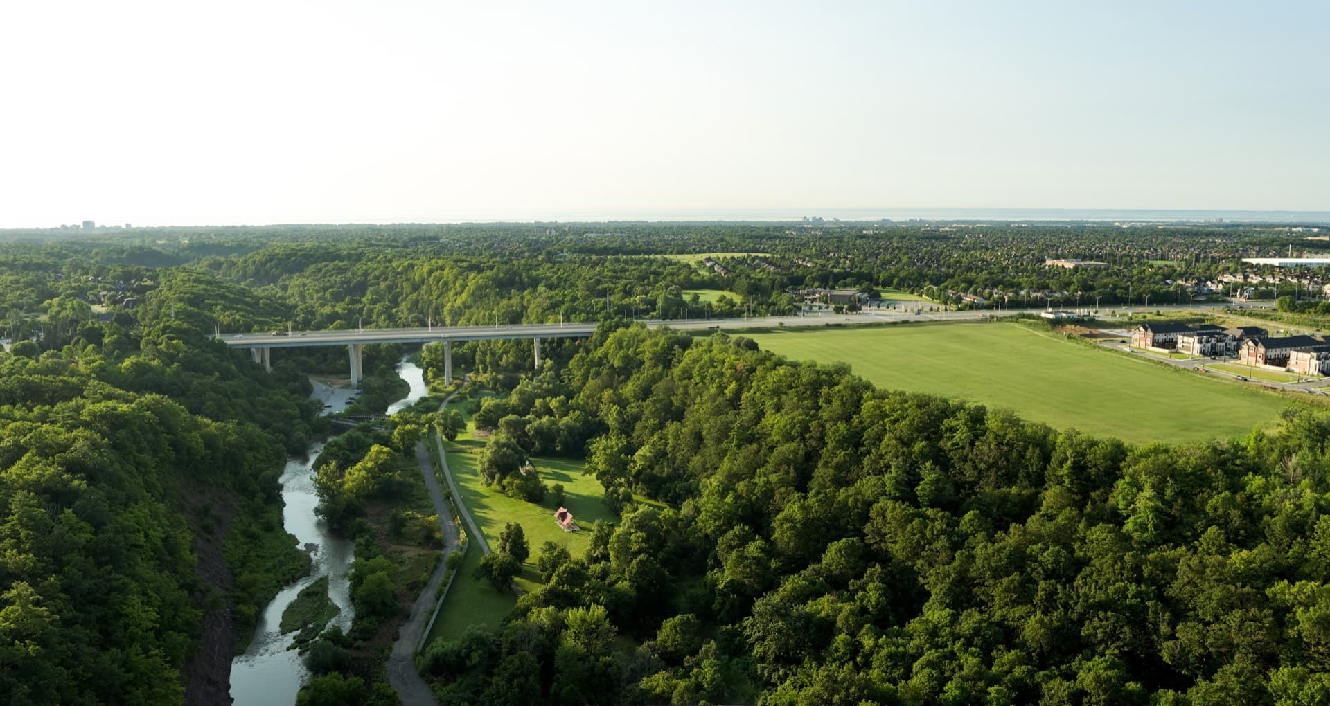 Five Oaks aerial rendering, Oakville, Ontario — site context at 1303 Dundas Street West alongside Sixteen Mile Creek
